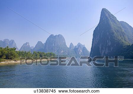 China, Guangxi Province, Guilin, Yangshuo, Li River with mountains View Large Photo Image Stock Photography - China, Guangxi Province, Guilin, Yangshuo, Li River with mountains. Fotosearch