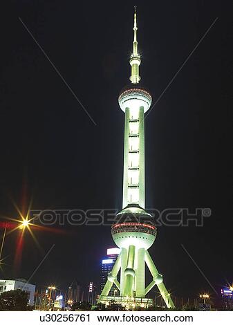 China, Shanghai, Pudong, Oriental Pearl Tower at night, low angle view View Large Photo Image Stock Image - China, Shanghai, Pudong, Oriental Pearl Tower at night, low angle view. Fotosearch