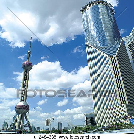 Stock Photo - China, Shanghai, Pudong, Oriental Pearl Tower and city skyline. Fotosearch
