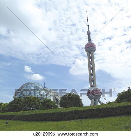 Stock Photography - China, Shanghai, Pudong, Oriental Pearl Tower and city skyline. Fotosearch