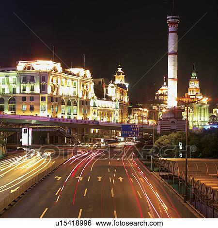 Stock Photograph - China, Shanghai, Pudong, The Bund, night (blurred motion). Fotosearch
