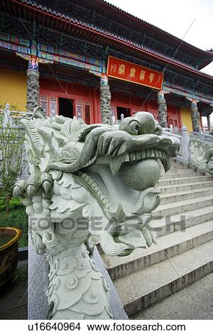 Picture - Dragon statue in front of temple. Fotosearch