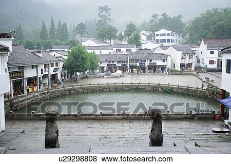 Stock Photo - Pond along houses, Mt. Jiuhua, Anhui, China, Asia. Fotosearch