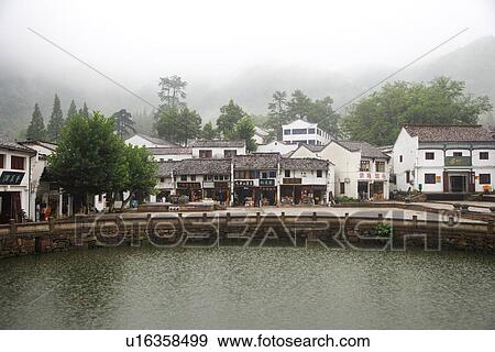 Pond along houses View Large Photo Image Stock Photo - Pond along houses. Fotosearch