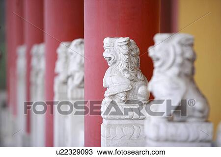 Stone lions by red column View Large Photo Image Stock Image - Stone lions by red column. Fotosearch