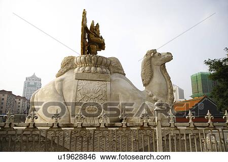 Camel statue with golden Buddha, buildings in the background View Large Photo Image Stock Photograph - Camel statue with golden Buddha, buildings in the background. Fotosearch