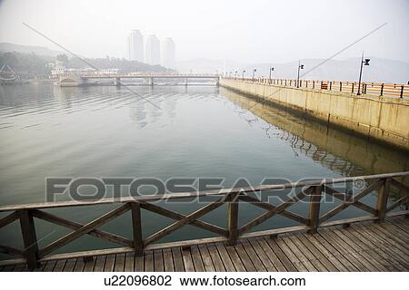 China, Liaoning Province, Wooden bridge on river View Large Photo Image Stock Image - China, Liaoning Province, Wooden bridge on river. Fotosearch