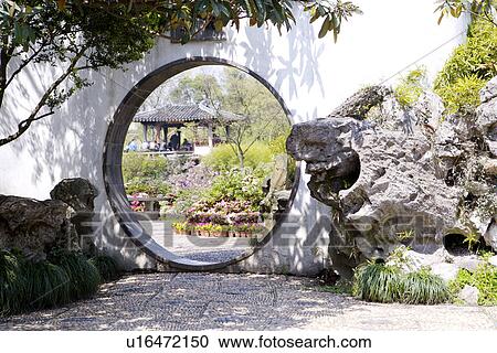 Stock Image - China, Jiangsu Province, Suzhou, The Humble Administrator's Garden, round gate. Fotosearch