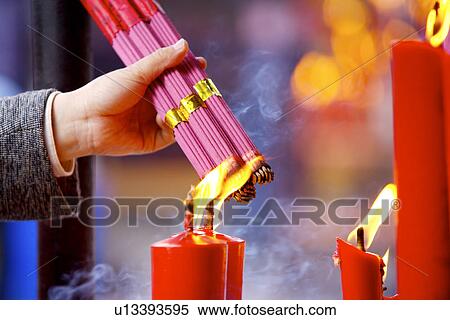 China, Suzhou, Hanshan Temple, hands with incense closing to candle View Large Photo Image Stock Photography - China, Suzhou, Hanshan Temple, hands with incense closing to candle. Fotosearch
