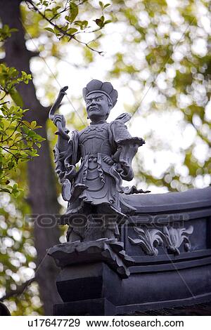 Stock Photo - China, Suzhou, Hanshan Temple, statue on roof. Fotosearch