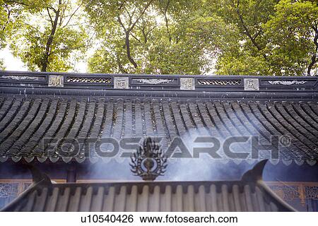 Stock Photograph - China, Suzhou, Hanshan Temple's roof with smoke. Fotosearch