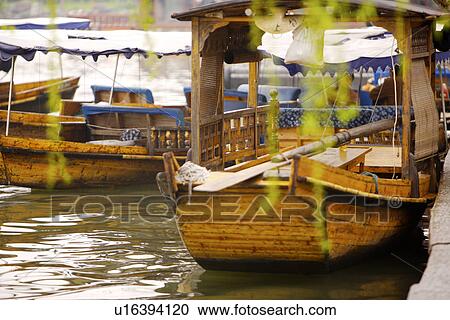 Stock Image - China, Zhejiang Province, Hangzhou, row boats on the West Lake. Fotosearch