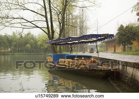 China, Zhejiang Province, Hangzhou, boat on the West Lake View Large Photo Image Stock Photo - China, Zhejiang Province, Hangzhou, boat on the West Lake. Fotosearch