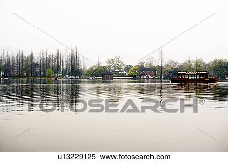 China, Zhejiang Province, Hangzhou, West Lake in overcast View Large Photo Image Stock Photography - China, Zhejiang Province, Hangzhou, West Lake in overcast. Fotosearch