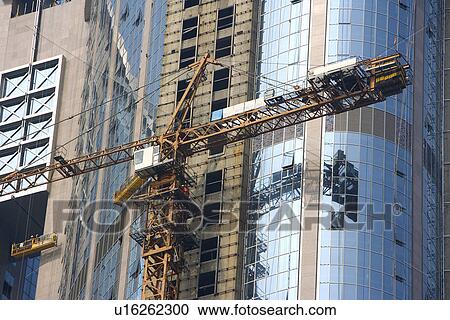 China,, Guangdong, Guangzhou, Crane and scaffolding by skyscrapers View Large Photo Image Stock Image - China,, Guangdong, Guangzhou, Crane and scaffolding by skyscrapers. Fotosearch