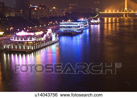 Stock Photograph - China,, Guangdong, Guangzhou, Pearl river at night. Fotosearch