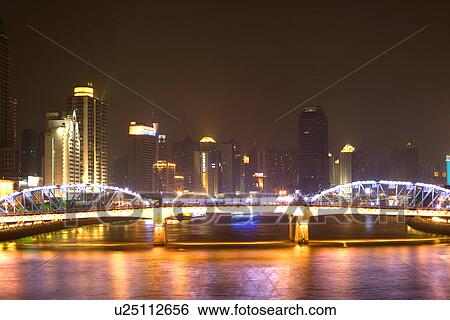 Stock Photograph - China, Guangdong, Guangzhou, Pearl river at night. Fotosearch