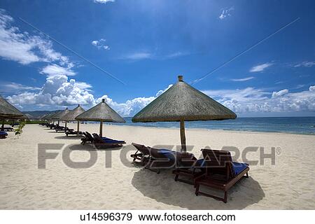 Beach chairs and umbrellas on beach, Hainan Province, China View Large Photo Image Stock Photo - Beach chairs and umbrellas on beach, Hainan Province, China. Fotosearch
