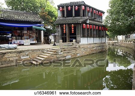 Asia, China, Jiangsu Province, Tongli Town, traditional residential houses along river View Large Photo Image Stock Image - Asia, China, Jiangsu Province, Tongli Town, traditional residential houses along river. Fotosearch