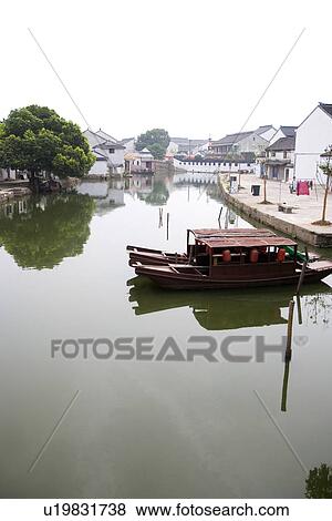 Asia, China, Jiangsu Province, Tongli Town, Rowing boats moored in water town View Large Photo Image Stock Photo - Asia, China, Jiangsu Province, Tongli Town, Rowing boats moored in water town. Fotosearch