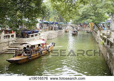 Asia, China, Jiangsu Province, Tongli Town, Rowing boats in the water town View Large Photo Image Stock Photograph - Asia, China, Jiangsu Province, Tongli Town, Rowing boats in the water town. Fotosearch