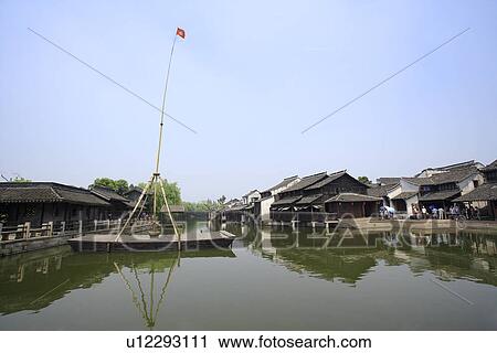 China, Zhejiang Province, Wuzhen, traditional architecture along the Grand Canal in the water town View Large Photo Image Stock Image - China, Zhejiang Province, Wuzhen, traditional architecture along the Grand Canal in the water town. Fotosearch