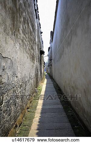China, Zhejiang Province, Wuzhen, traditional alley in the ancient water town View Large Photo Image Stock Photo - China, Zhejiang Province, Wuzhen, traditional alley in the ancient water town. Fotosearch