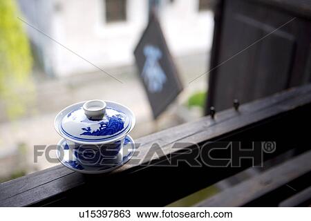 China, Zhejiang Province, Xitang Ancient Scenic Town, tea cup and saucer in the foreground View Large Photo Image Stock Image - China, Zhejiang Province, Xitang Ancient Scenic Town, tea cup and saucer in the foreground. Fotosearch
