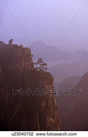 Stock Image - China, Anhui, Mt. Huangshan, The Monkey Gazing At The Sea. Fotosearch