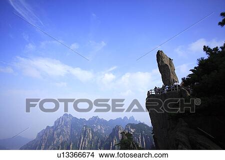 Picture - China, Anhui Province, Mt. Huangshan, tourists with Flying Stone. Fotosearch
