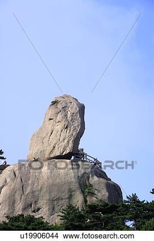 China, Anhui Province, Mt. Huangshan, tourists with Flying Stone View Large Photo Image Picture - China, Anhui Province, Mt. Huangshan, tourists with Flying Stone. Fotosearch