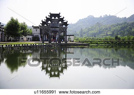 China, Anhui Province, Xidi, Memorial archway with reflection in the river View Large Photo Image Stock Image - China, Anhui Province, Xidi, Memorial archway with reflection in the river. Fotosearch