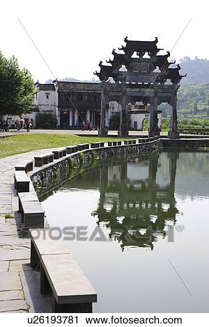 China, Anhui Province, Xidi Village, Memorial archway with reflection in the river View Large Photo Image Stock Image - China, Anhui Province, Xidi Village, Memorial archway with reflection in the river. Fotosearch