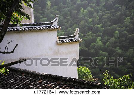 Stock Image - China, Anhui, Mount Huangshan area, bamboo forest and roof. Fotosearch