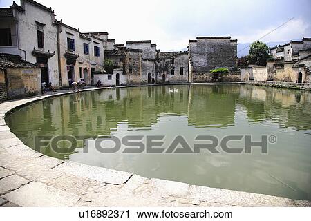 Stock Image - Half-moon pond, Hongcun village, Anhui Province, China, Asia. Fotosearch