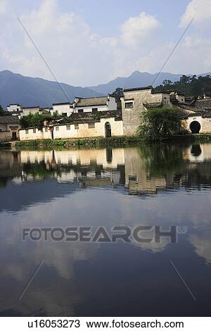 Traditional residential houses with reflection in the river View Large Photo Image Stock Image - Traditional residential houses with reflection in the river. Fotosearch