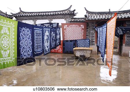 China, Yunnan Province, Dali, Clothing hanging on clothesline View Large Photo Image Stock Photograph - China, Yunnan Province, Dali, Clothing hanging on clothesline. Fotosearch