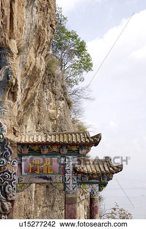 China, Yunnan Province, Kunming, entrance gate on cliff View Large Photo Image Stock Image - China, Yunnan Province, Kunming, entrance gate on cliff. Fotosearch