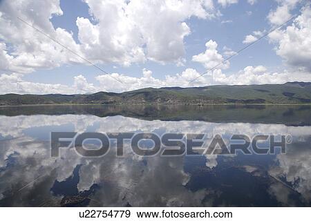 China, Yunnan Province, Sky reflected in sea View Large Photo Image Stock Photo - China, Yunnan Province, Sky reflected in sea. Fotosearch