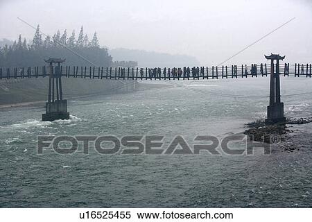 Stock Photography - China, Sichuan, Bridge over Dujiang Dam. Fotosearch