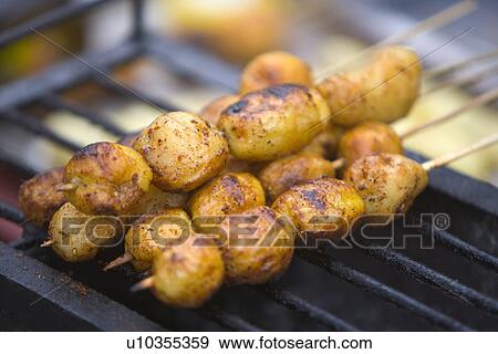 China, Sichuan Province, Potatoes skewers on grill View Large Photo Image Stock Photo - China, Sichuan Province, Potatoes skewers on grill. Fotosearch