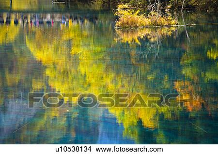 China, Sichuan Province, Nine Village Valley, Trees reflected into lake View Large Photo Image Picture - China, Sichuan Province, Nine Village Valley, Trees reflected into lake. Fotosearch