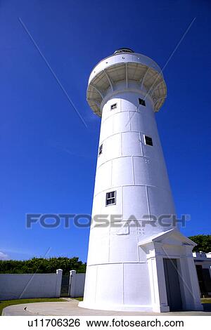 Stock Photograph - Eluanbi Lighthouse against blue sky. Fotosearch