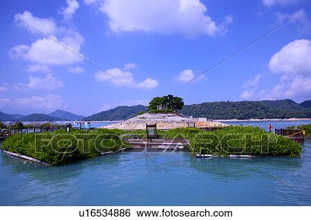 Stock Photograph - Taiwan, Island in Sun-moon Lake. Fotosearch