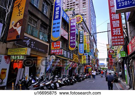 Stock Photography - Asia, Taiwan, Taipei, advertising signs and motorcycles in a row. Fotosearch