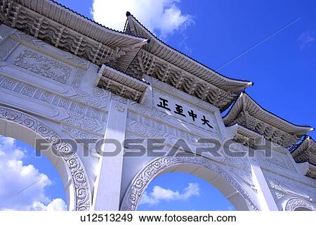 Stone gate way against blue sky, low angle view View Large Photo Image Stock Photo - Stone gate way against blue sky, low angle view. Fotosearch