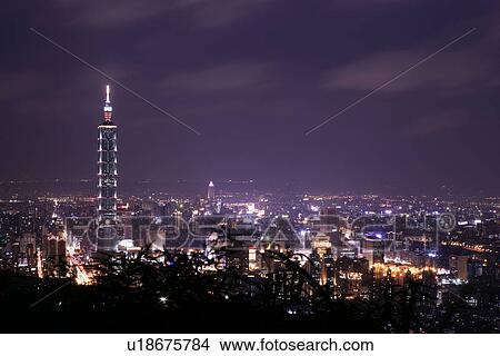 Picture - Taipei cityscape at night in distance, elevated view. Fotosearch