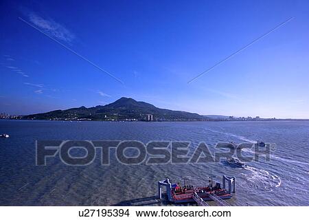 Asia, Taiwan, Taipei, Goddess Of Mercy Mountain in the distance, horizon over water View Large Photo Image Picture - Asia, Taiwan, Taipei, Goddess Of Mercy Mountain in the distance, horizon over water. Fotosearch