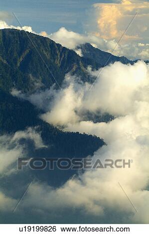 Stock Photograph - Mountain with clouds. Fotosearch