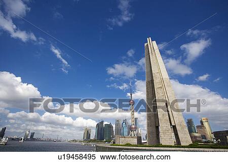 China, Shanghai, Heroes Of The Revolution Monument and Oriental Pearl Tower View Large Photo Image Stock Photography - China, Shanghai, Heroes Of The Revolution Monument and Oriental Pearl Tower. Fotosearch